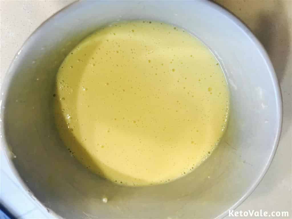 mixing eggs to cream cheese
