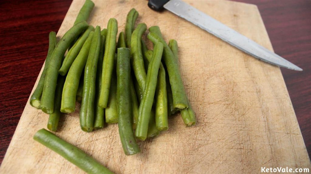 Cutting green beans in half