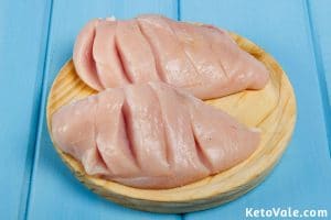 Cutting slits in chicken