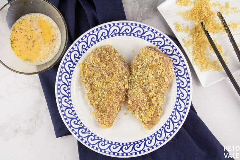 coat chicken with ground pork rinds