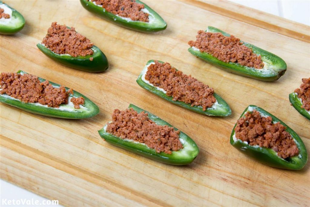 Add ground beef in each jalapeno