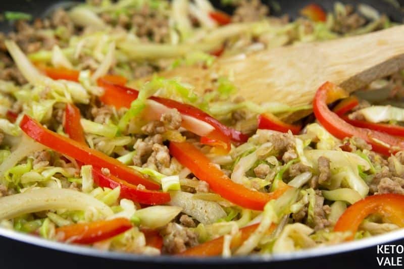 stir chopped veggies to pork