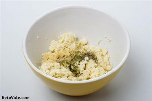 Mix cauliflower with cheese and egg