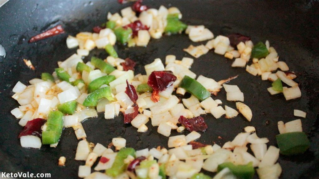 Saute onion, green bell pepper, and chipotle dried chili