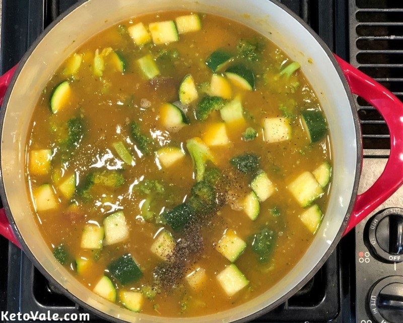 Add chicken broth to pumpkin soup