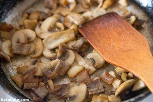 Fry mushrooms and chopped bacon