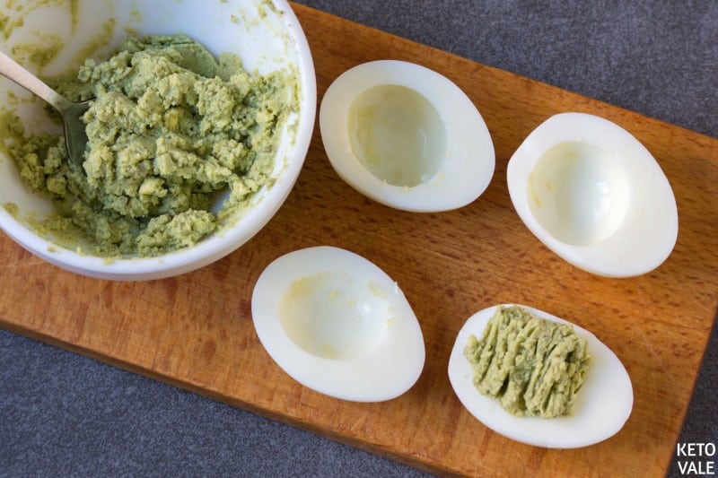 Scoop avocado mixture back into egg