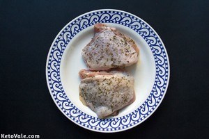 Season both sides of chicken thighs