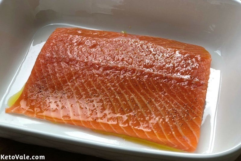 Season salmon with olive oil salt pepper