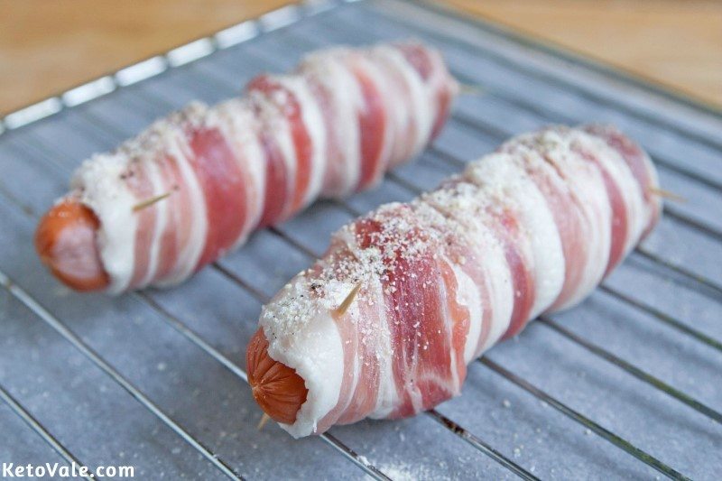 Wrap bacon around hot dogs