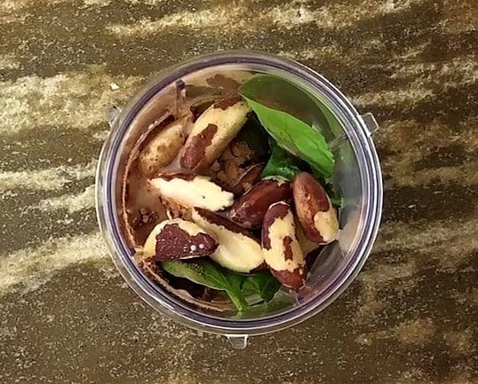 Blend Brazil nuts, spinach, strawberries