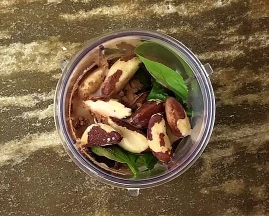 Blend Brazil nuts, spinach, strawberries