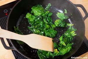 Cook spinach in butter