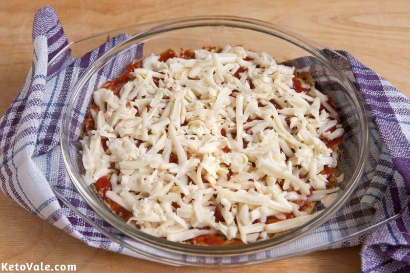 Top with tomato sauce and cheese