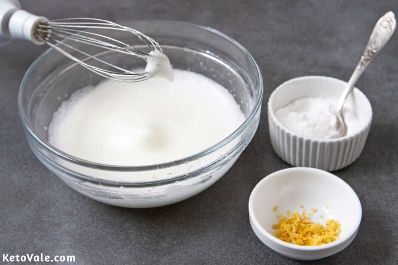 Whisk egg whites with lemon juice