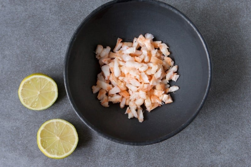 Marinate cooked shrimp with lemon juice