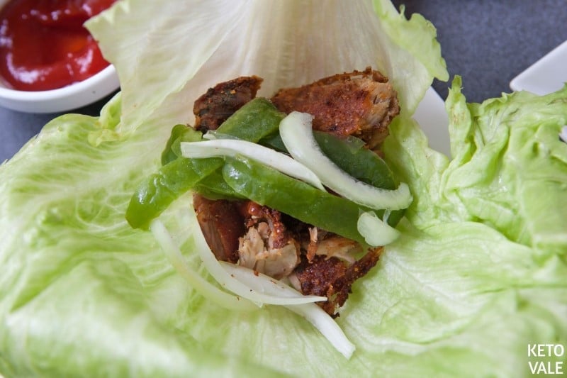 Wrap lettuce with pork, onion and sauce