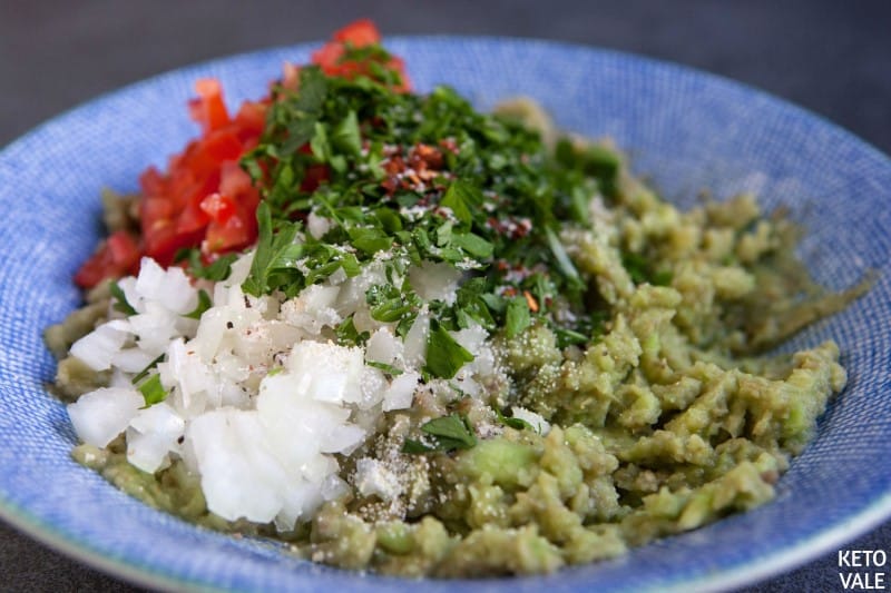 mashed avocado onion tomato