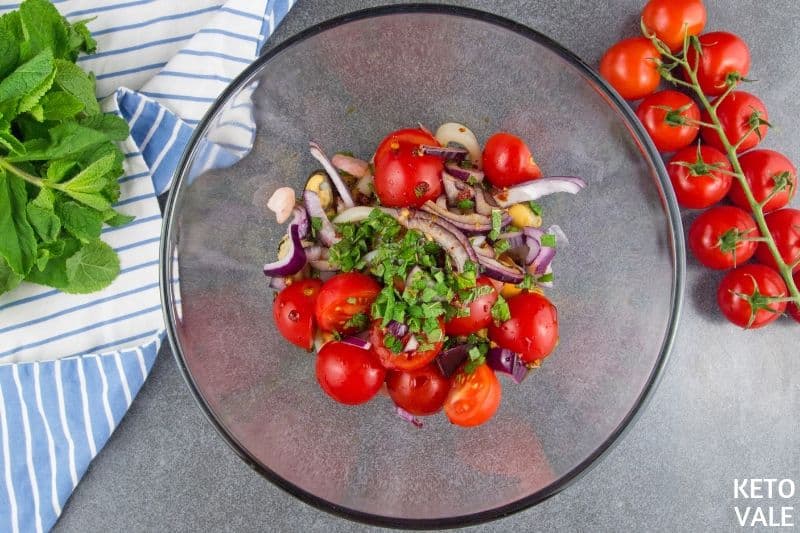 mixing seafood with veggies