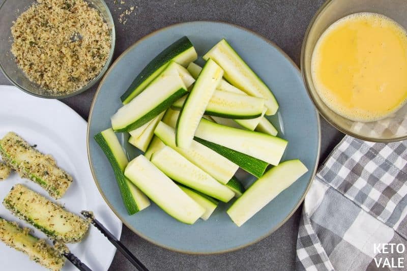 dip zucchini into egg parmesan mixture