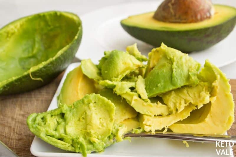 scooping avocado