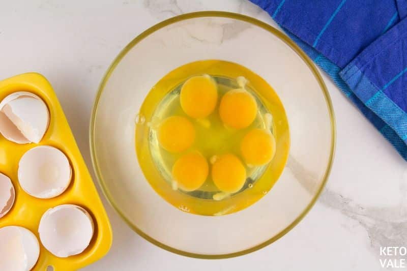 crack eggs in a bowl