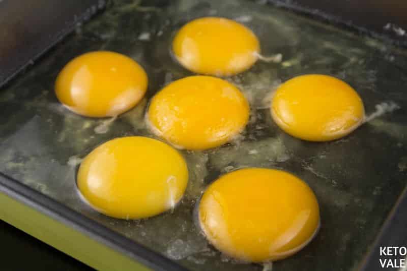 pour eggs in greased pan