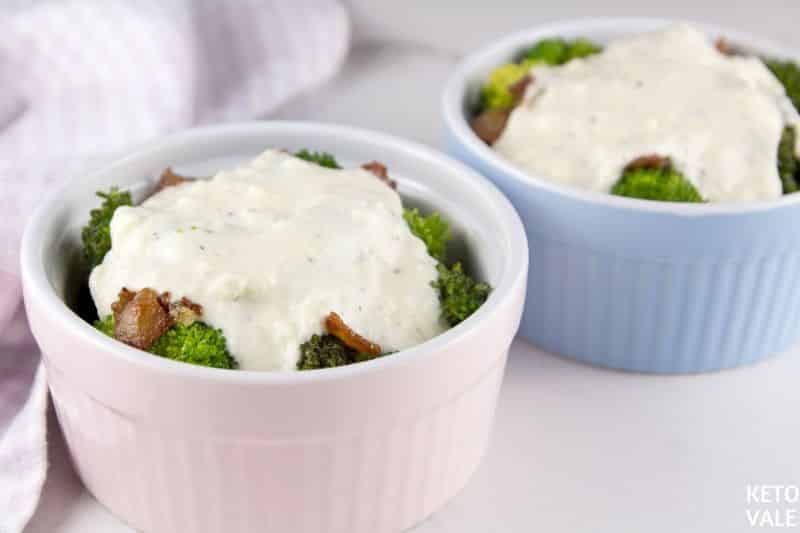 pour creamy sauce on broccoli