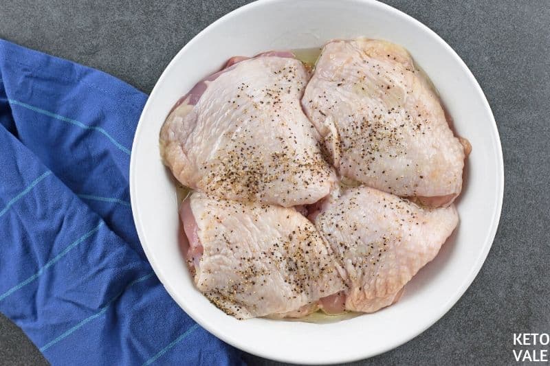 rub chicken thighs with olive oil