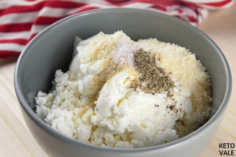 combine cheeses garlic powder