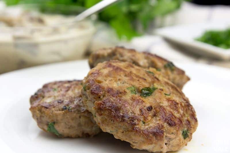 plate patties top mushroom sauce