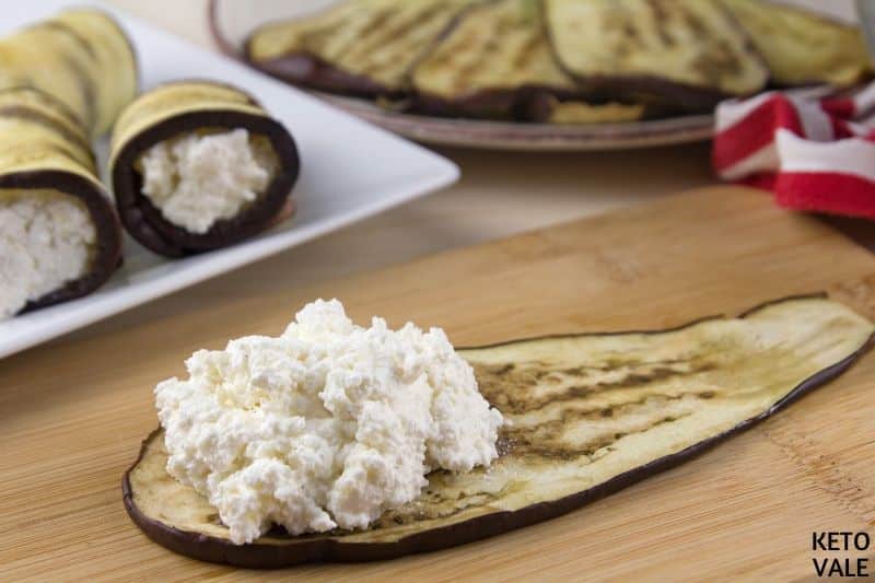 spoon cheese mixture eggplant slices