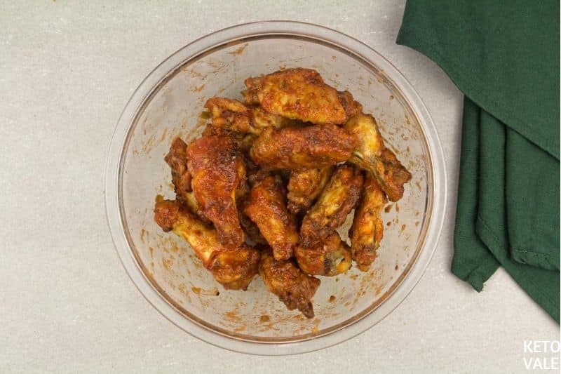 coat chicken wings with enchilada sauce