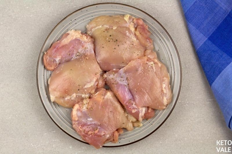 season chicken thighs salt pepper