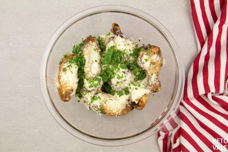 coat chicken wings with parmesan