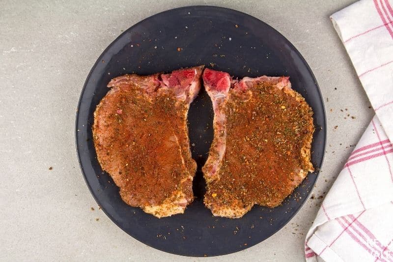 rub spices on pork chops