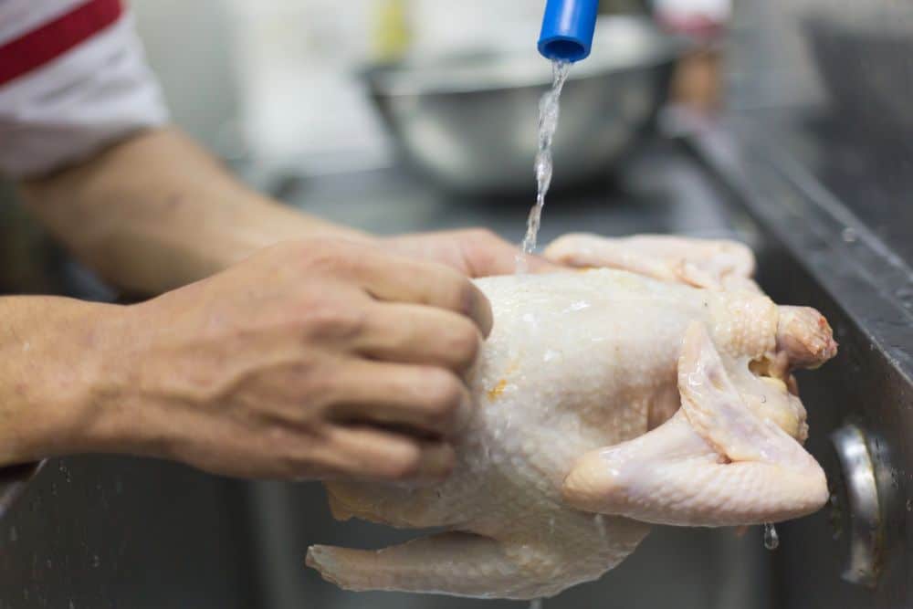 wash raw chicken
